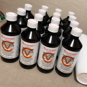 Several Wockhardt brand liquid amber suspension bottles with a secure closure cap